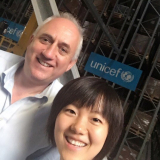 Yuxi Wu at the UNICEF Supply Chain Division fully automated warehouse in Copenhagen, Denmark, with Paul Molinaro, who is the Chief of Supply Chain in the MENA regional office.
