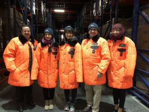 Jana Boerger and fellow doctoral students at Georgia Tech bundled up to visit Americold's cooling warehouses where they explored cold chain challenges with Americold's Vice President David Stuver.