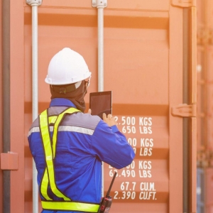 A Port of Savannah employee working with a shipping container